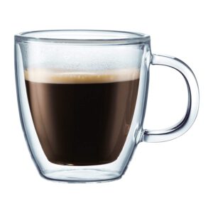 A glass mug filled with coffee.